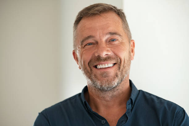A retired adult feeling calm and confident about their finances at home.